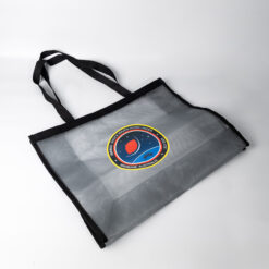 black canvas tote bag with circular crest patch