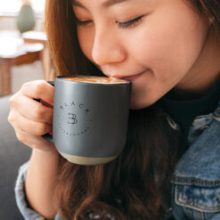 350ml charcoal coffee mug with custom logo lady drinking