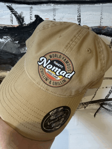 Nomad branded dad cap with embroidered patch tan