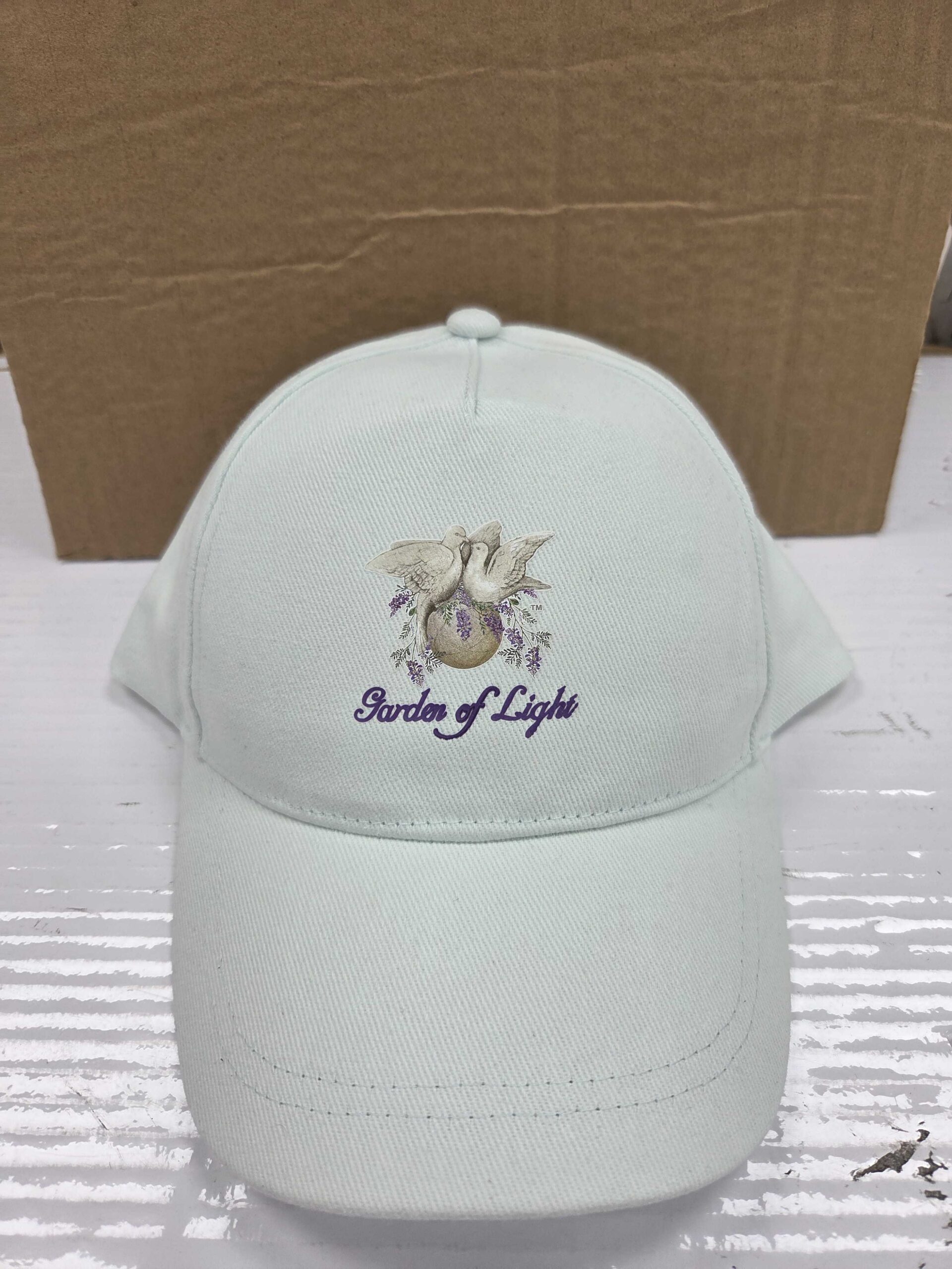 White embroidered cap with custom crest logo”